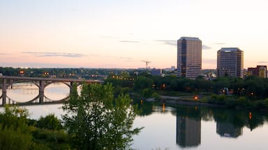 Saskatoon showing a city, a sunset and a bridge