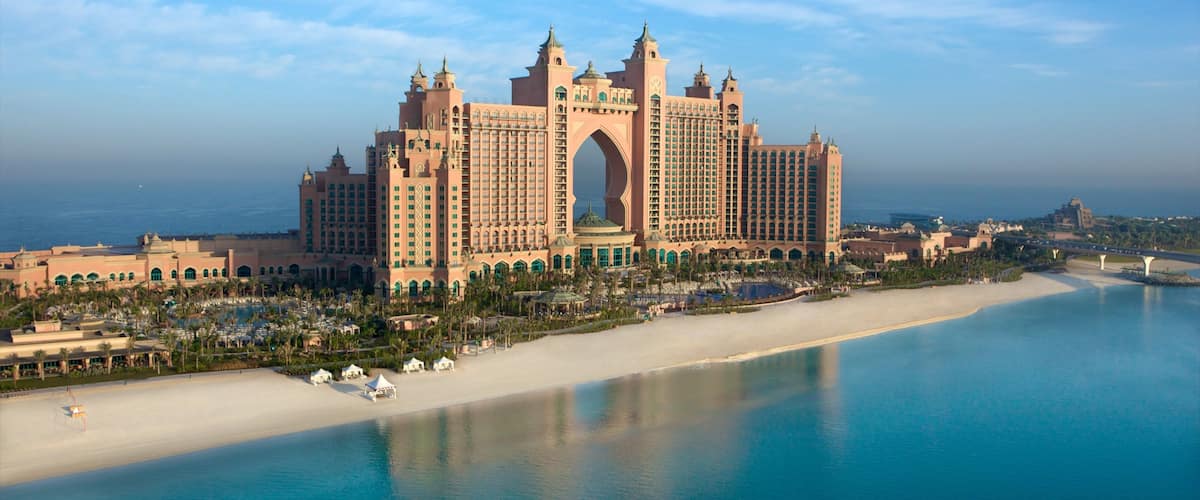 Dubai Emirate showing tropical scenes, modern architecture and a beach