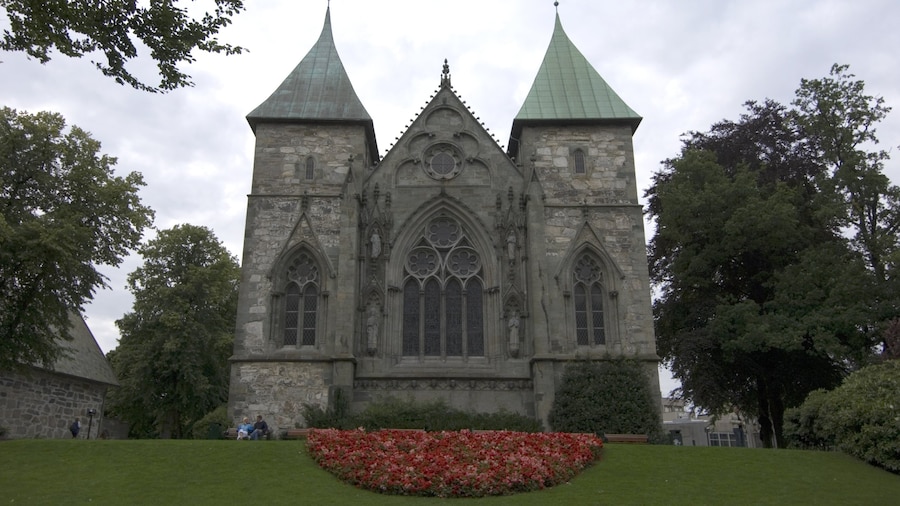 Stavanger Cathedral showing heritage architecture, a garden and religious aspects