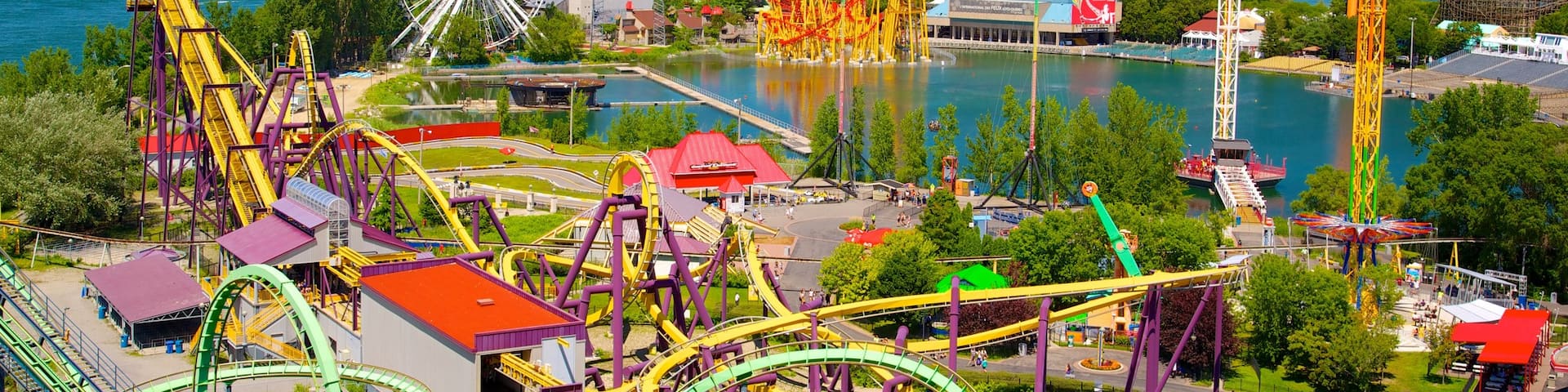 La Ronde Six Flags showing rides, a bay or harbor and a city