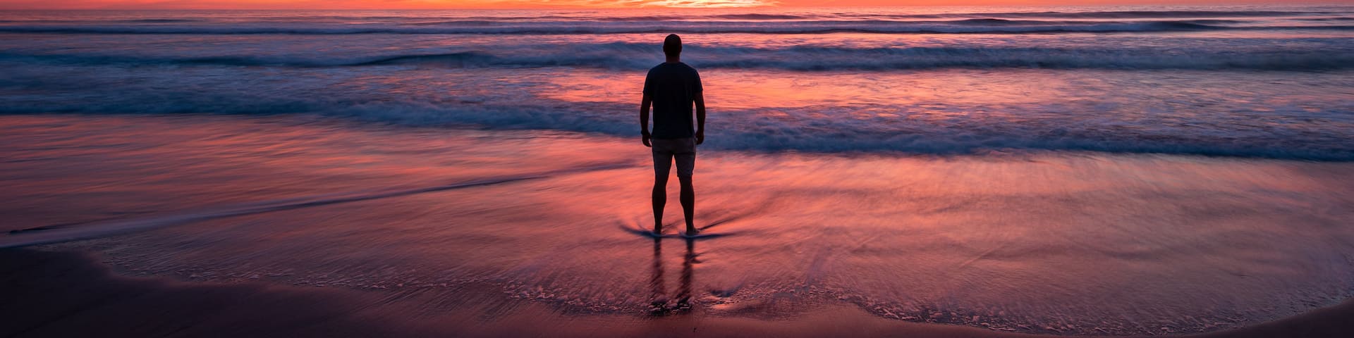 Torrey Pines State Beach featuring a sandy beach, general coastal views and a sunset