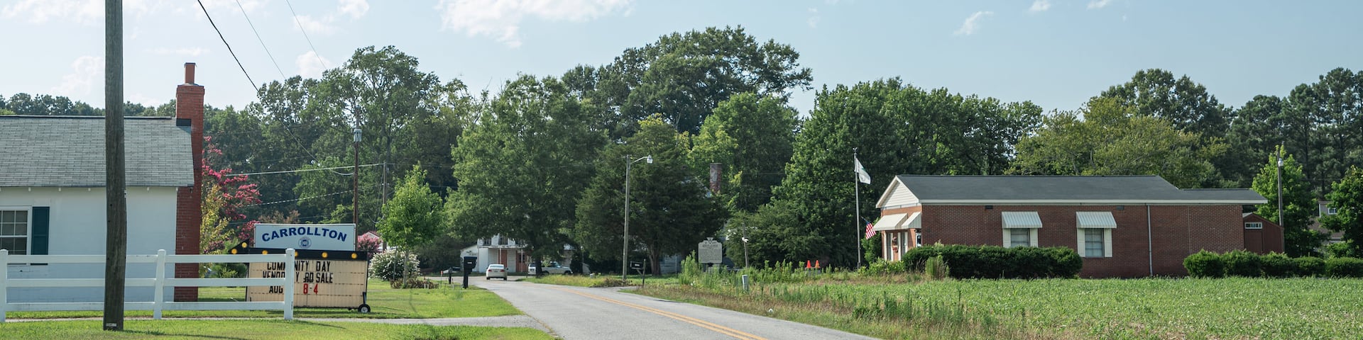 Carrollton featuring farmland and a small town or village
