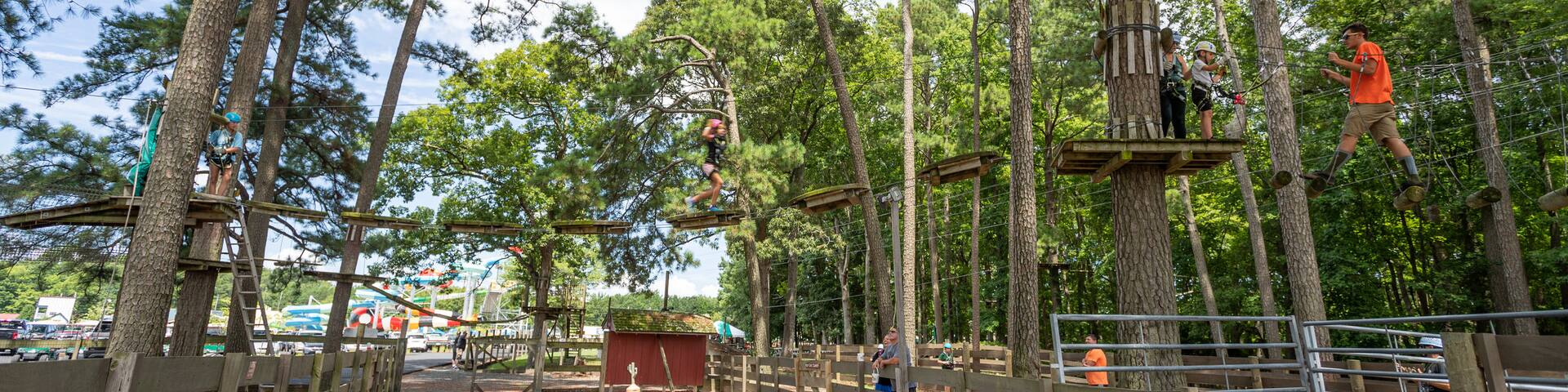 Frontier Town Water Park and Golf showing a suspension bridge or treetop walkway