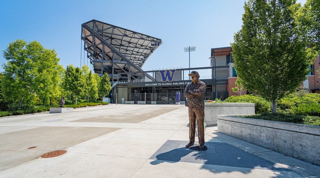 Husky Stadium showing signage and a statue or sculpture