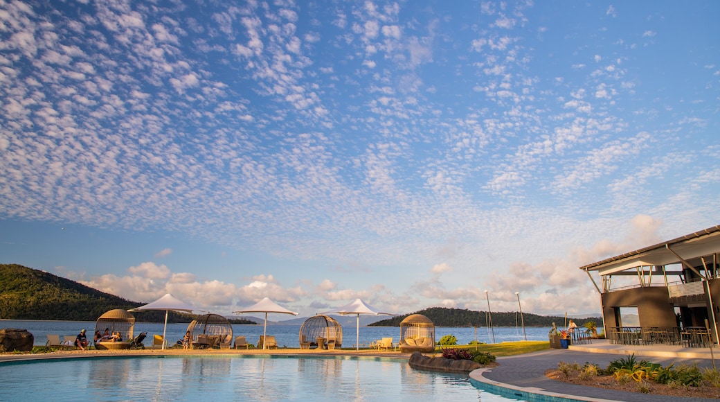 Daydream Island which includes a sunset and a pool