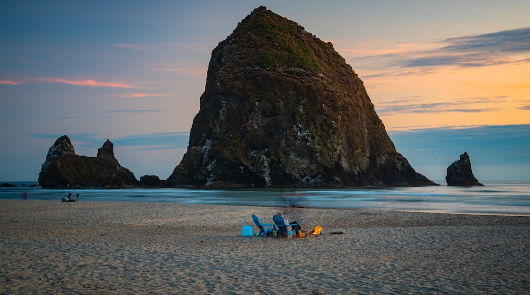 Cannon Beach featuring island views, a sunset and general coastal views