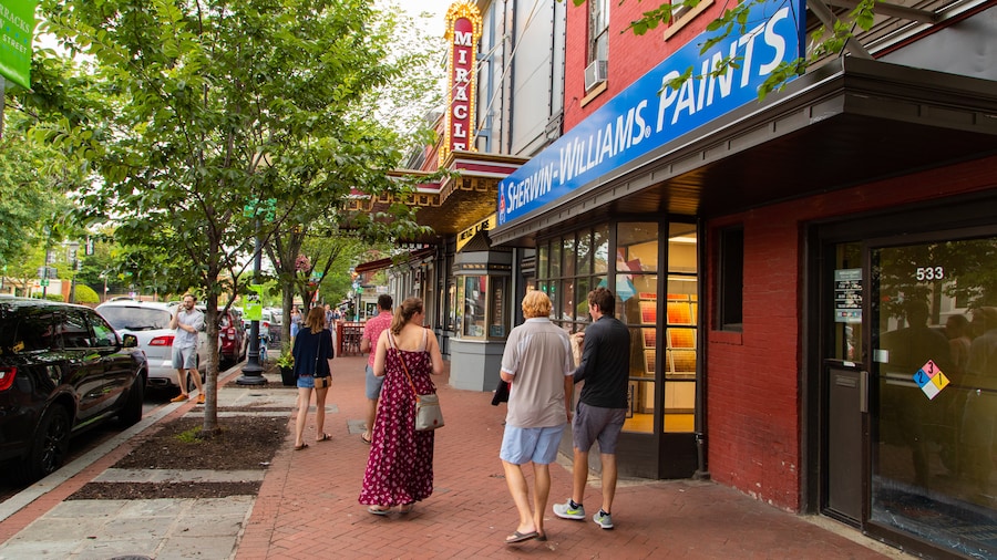 Eastern Market storefronts with visitors walking along the sidewalk in Washington, D.C.