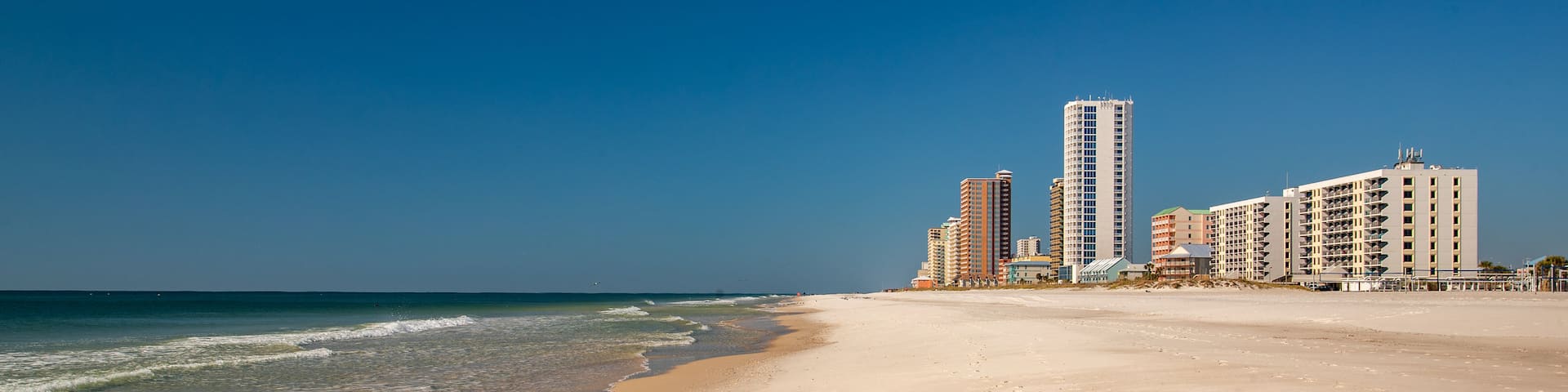 Gulf Shores Beach showing a coastal town, general coastal views and a beach