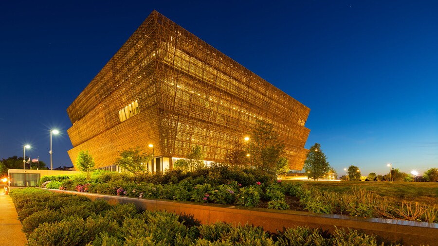 Exterior view of the National Museum of African American History and Culture at night in Washington, D.C.