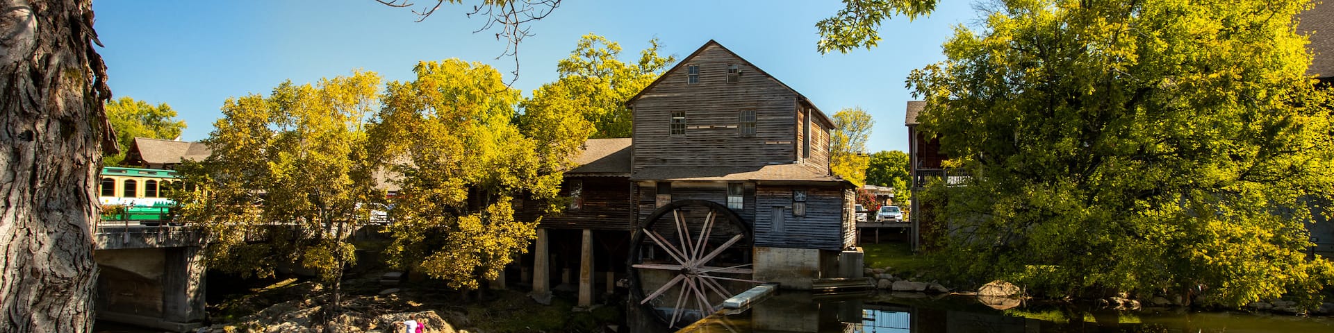 Old Mill which includes heritage elements and a river or creek