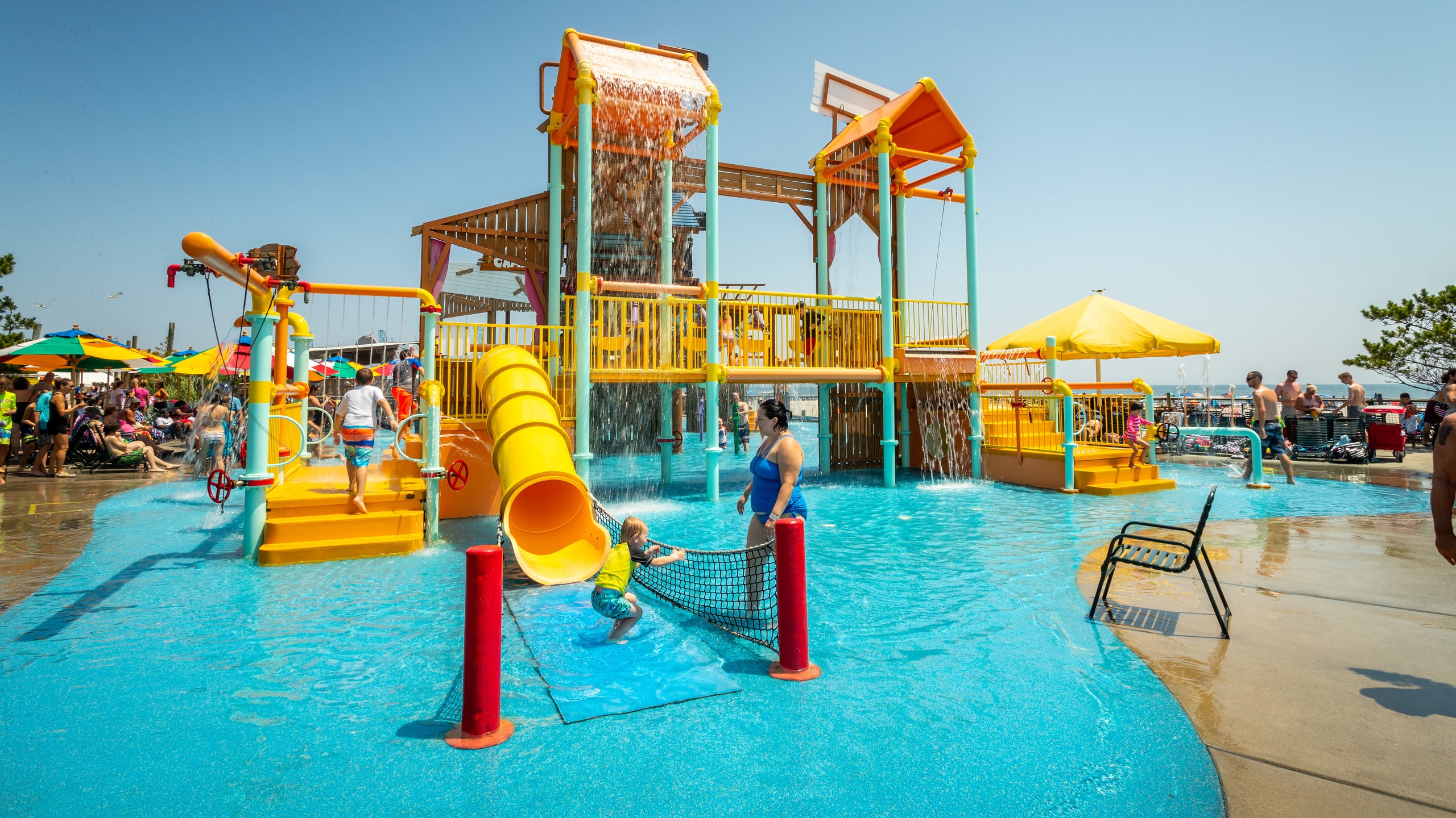 Raging Waters featuring a waterpark as well as a family