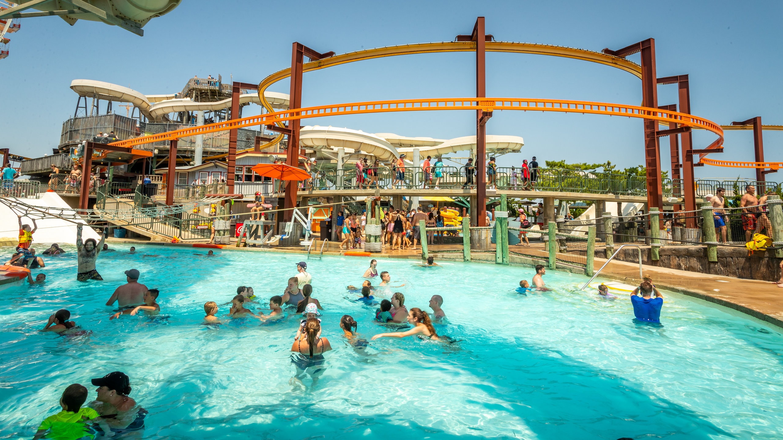 Raging Waters showing a waterpark and swimming as well as a large group of people