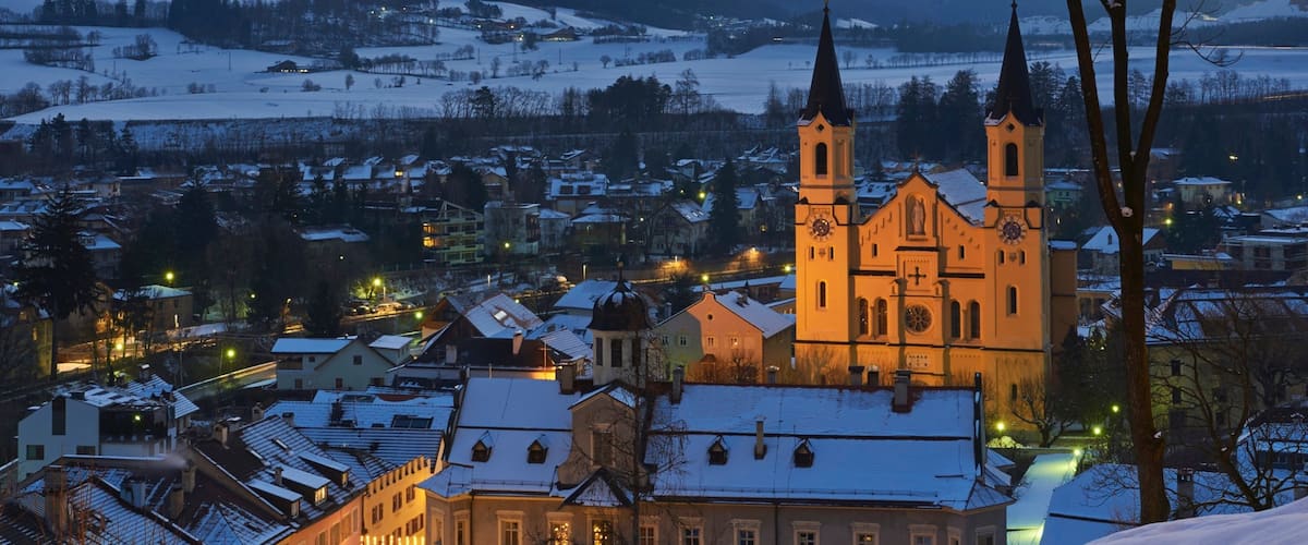 Brunico showing night scenes, a city and a church or cathedral