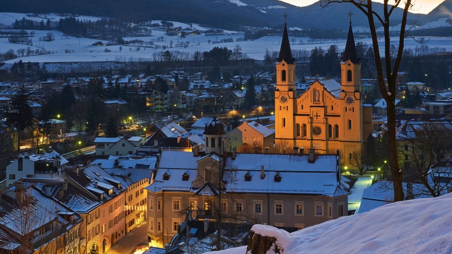Brunico showing night scenes, a city and a church or cathedral