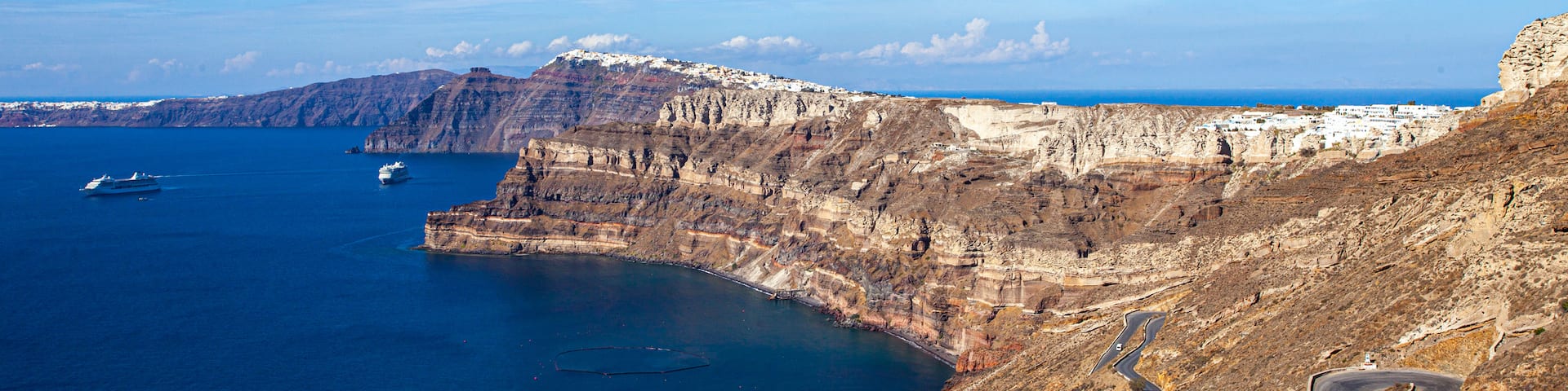 Santorini featuring rugged coastline and general coastal views