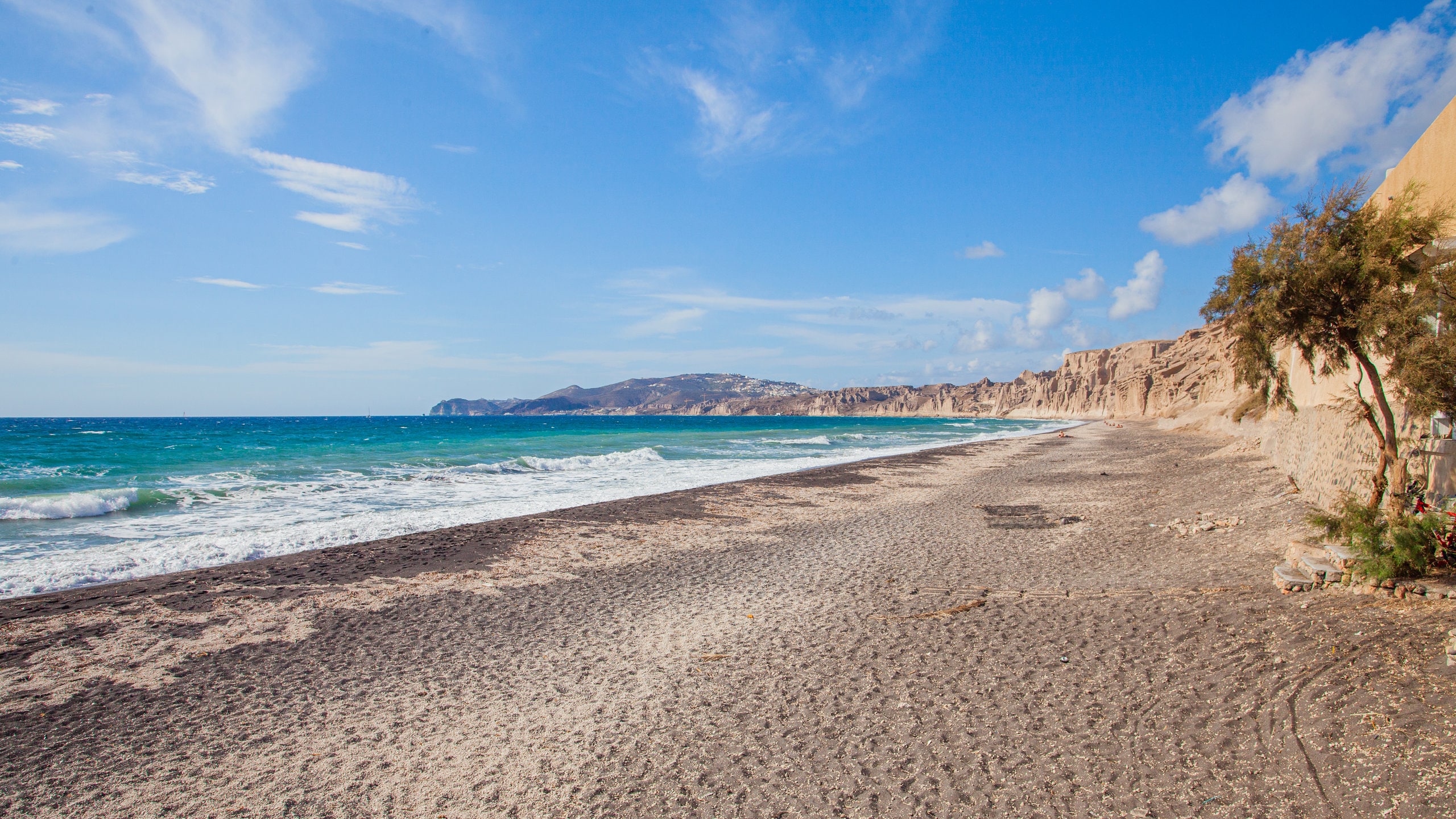 Santorini which includes general coastal views and a beach