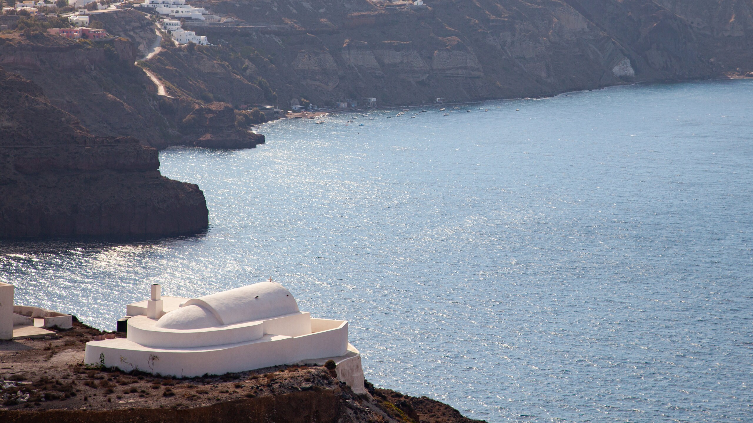 Santorini featuring rugged coastline and general coastal views