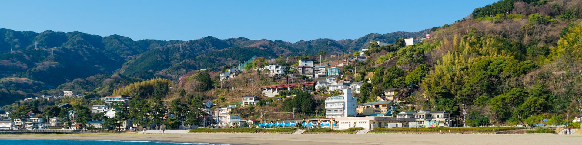 Nagahama Beach which includes a beach, a coastal town and general coastal views