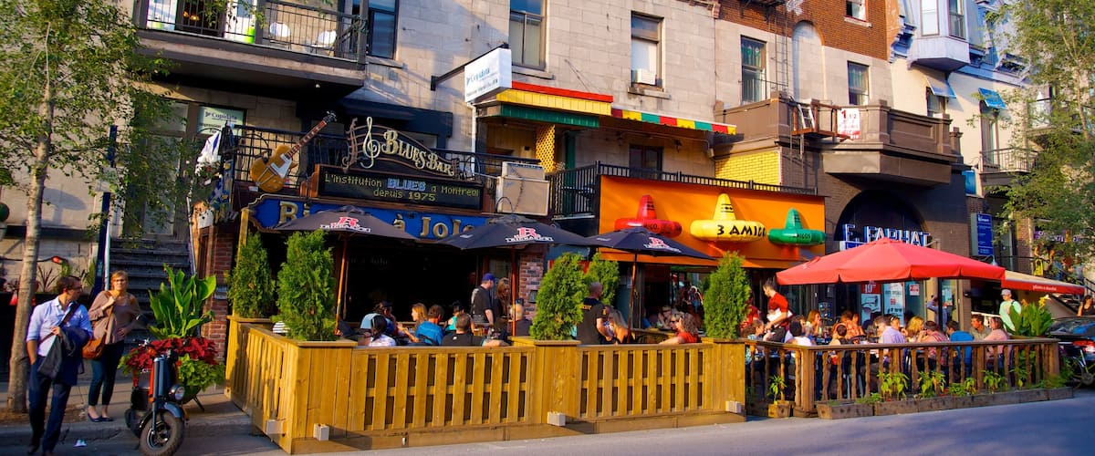Latin Quarter which includes outdoor eating, cafe lifestyle and a city