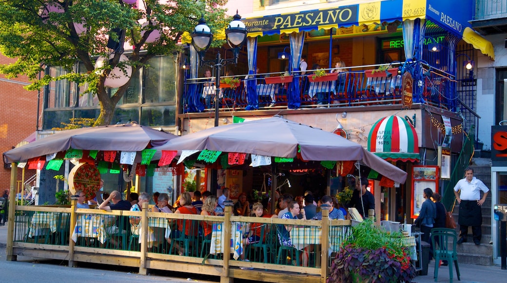 Latin Quarter featuring a city, outdoor eating and signage