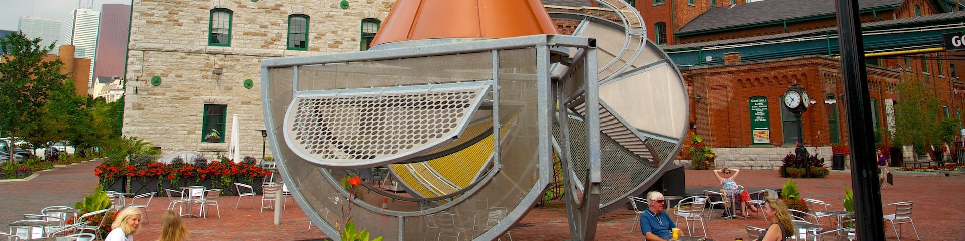 The Distillery Historic District which includes outdoor eating, a city and outdoor art