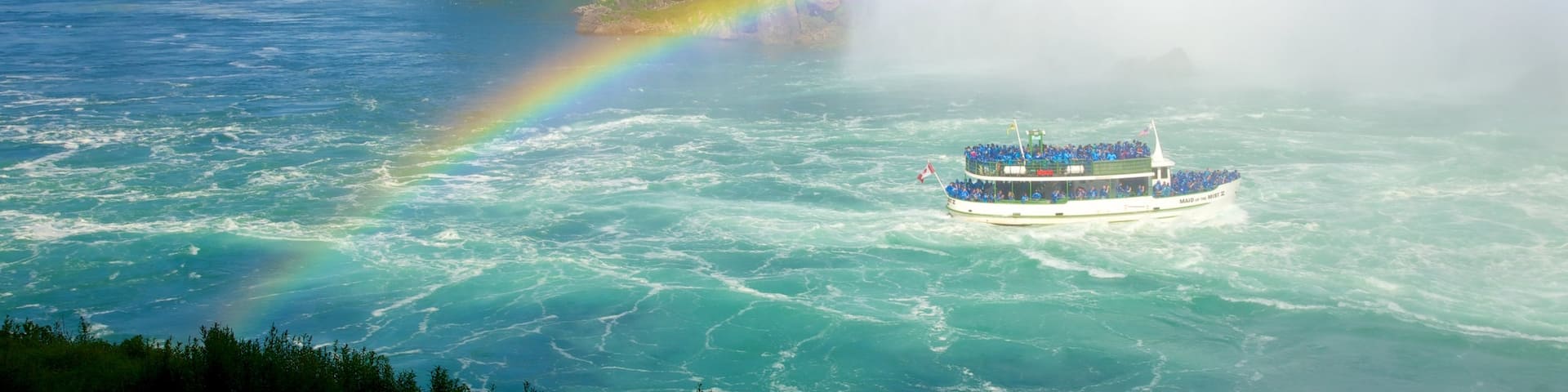 Journey Behind The Falls showing boating, a cascade and a ferry