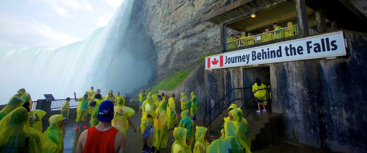 Journey Behind The Falls which includes a waterfall, hiking or walking and signage