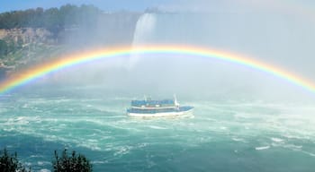 Journey Behind The Falls featuring a cascade, a river or creek and boating