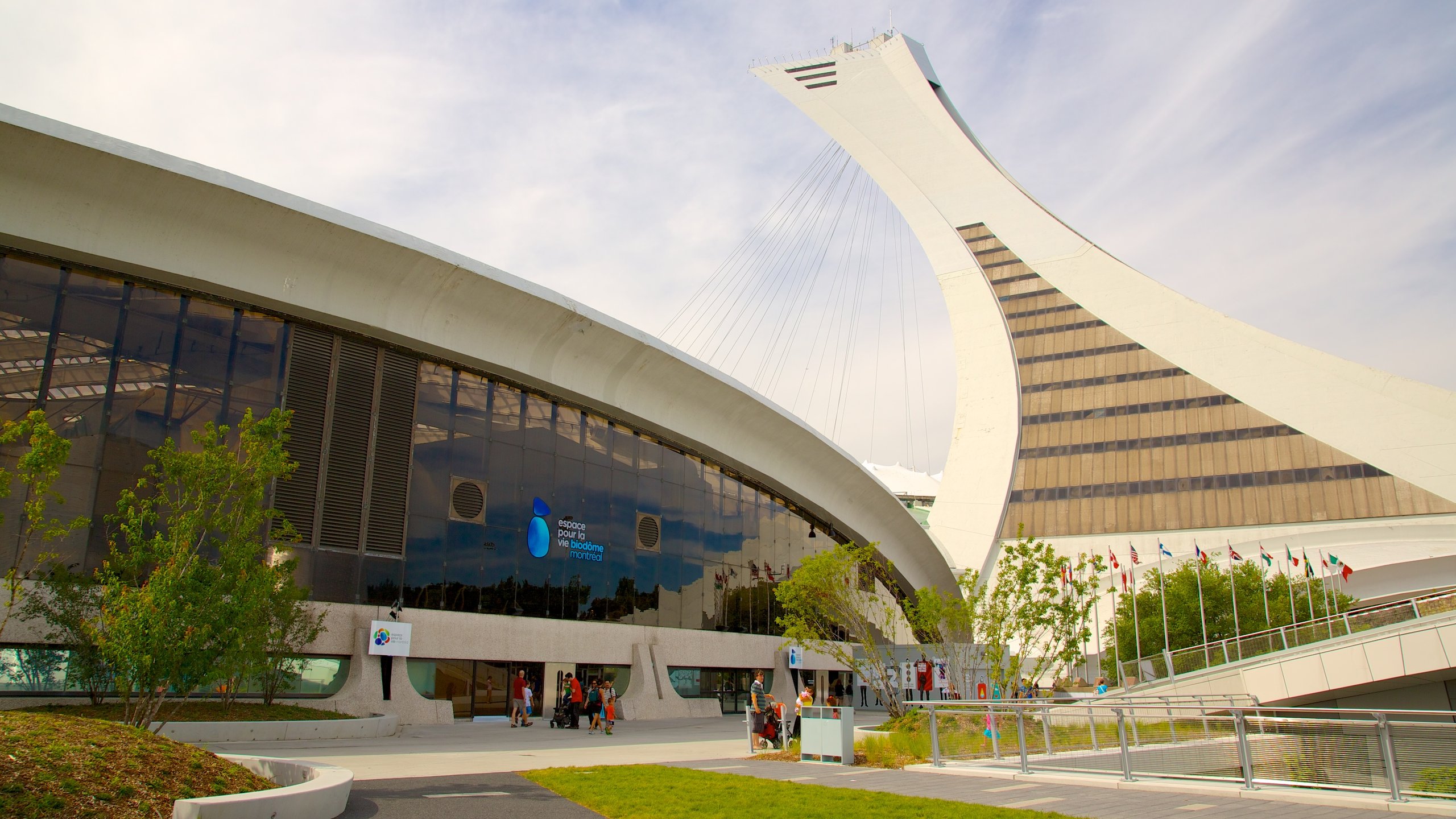 Exterior view of Montreal Biodome with modern architecture and Olympic Park surroundings.