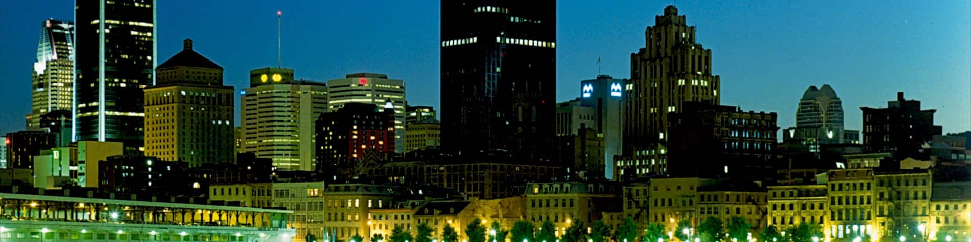 Old Port of Montreal featuring a city, a bay or harbor and night scenes