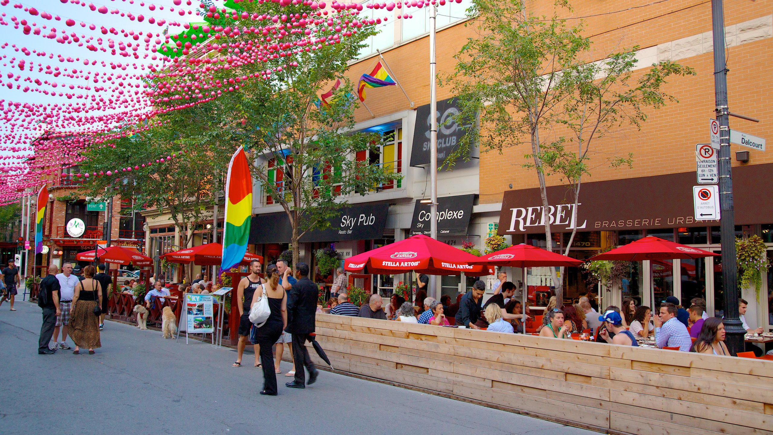 Gay Village which includes a bar, a city and street scenes