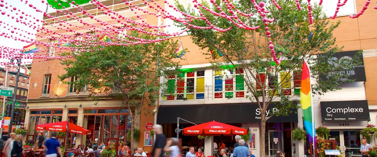 Gay Village mettant en vedette scĂšnes de rue, signalisation et sortie au restaurant