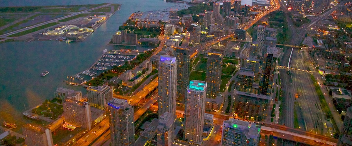 CN Tower which includes general coastal views, a city and a high rise building