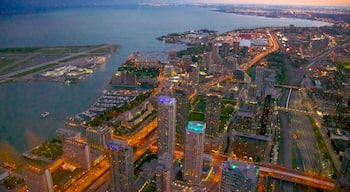 CN Tower which includes a sunset, central business district and general coastal views