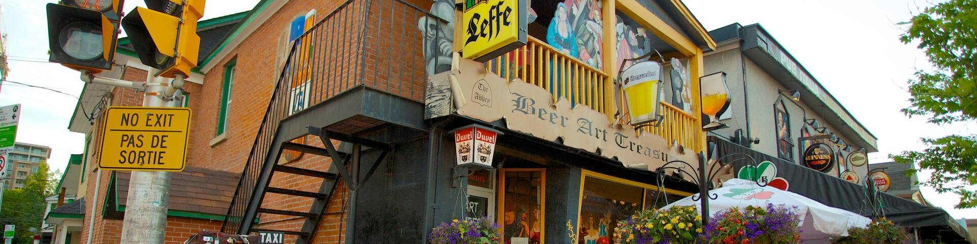 Little Italy which includes street scenes, a city and signage