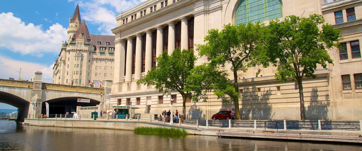 Rideau Canal featuring a river or creek, a castle and an administrative buidling