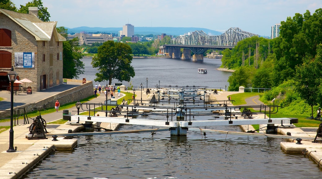 Rideau Canal showing a city, a river or creek and a bridge