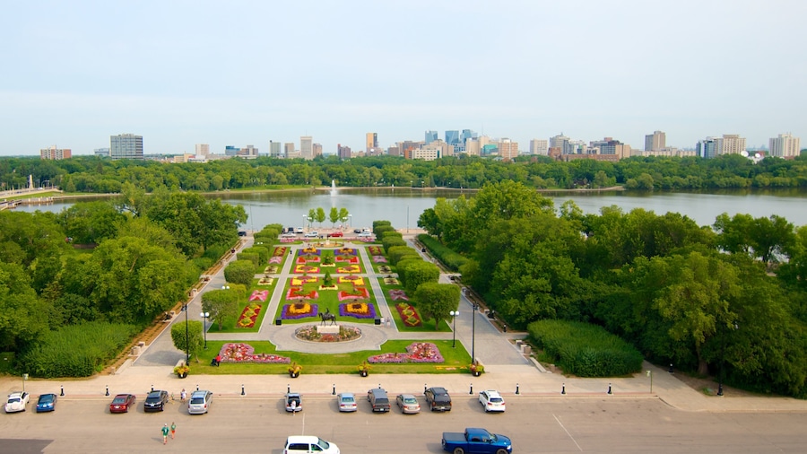 Saskatchewan Legislative Building which includes a city, a garden and a river or creek
