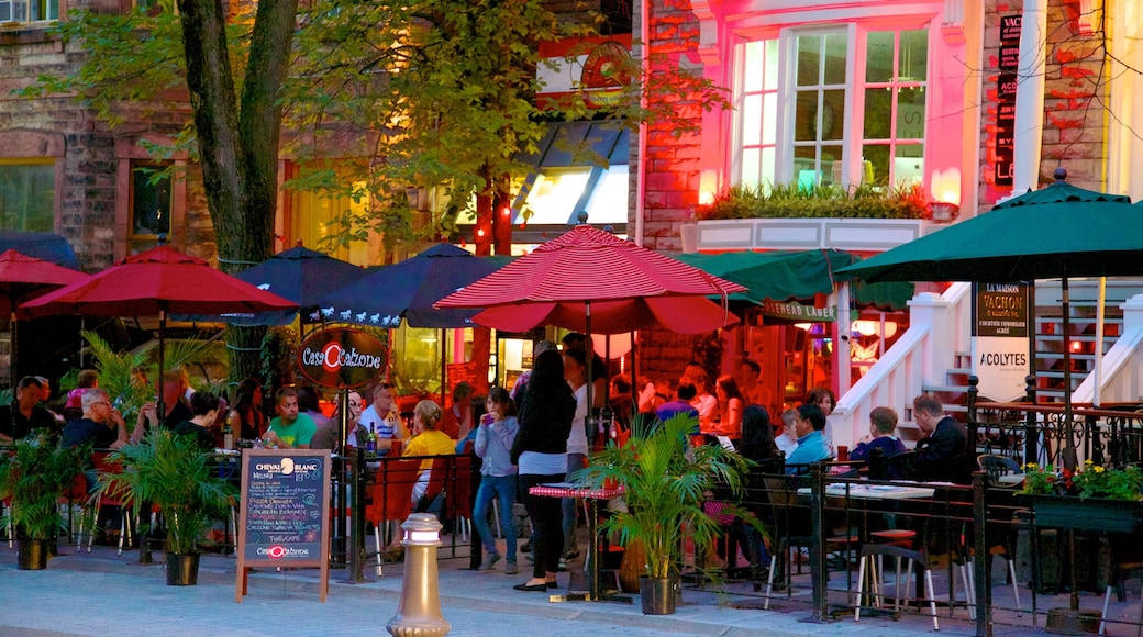 Grande Allee which includes night scenes, outdoor eating and dining out