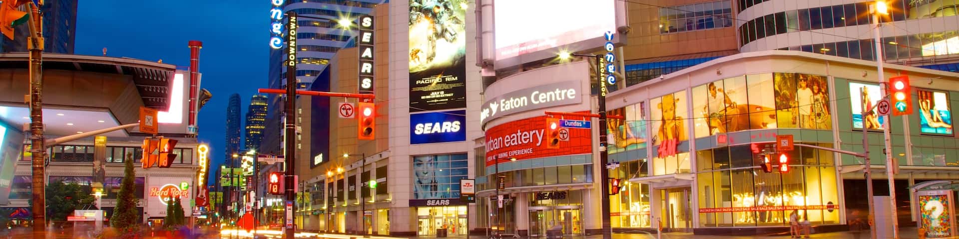 Yonge Street Shopping District featuring night scenes, signage and a city