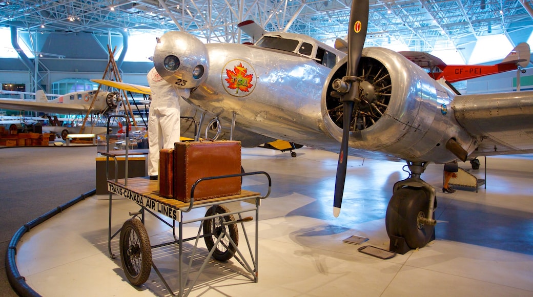 Canada Aviation and Space Museum showing aircraft and interior views as well as an individual male