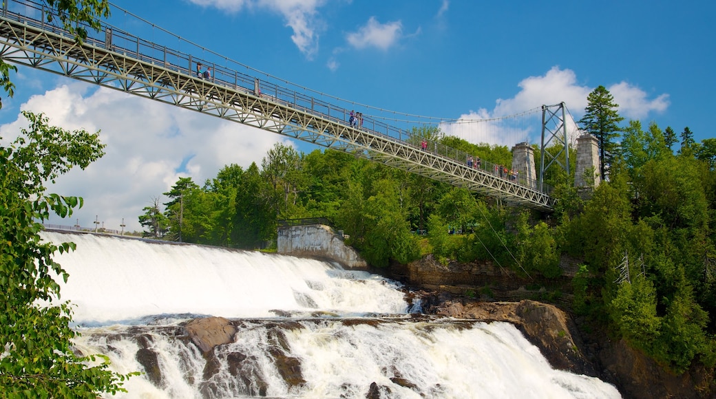 Montmorency Falls featuring a suspension bridge or treetop walkway, a waterfall and a river or creek