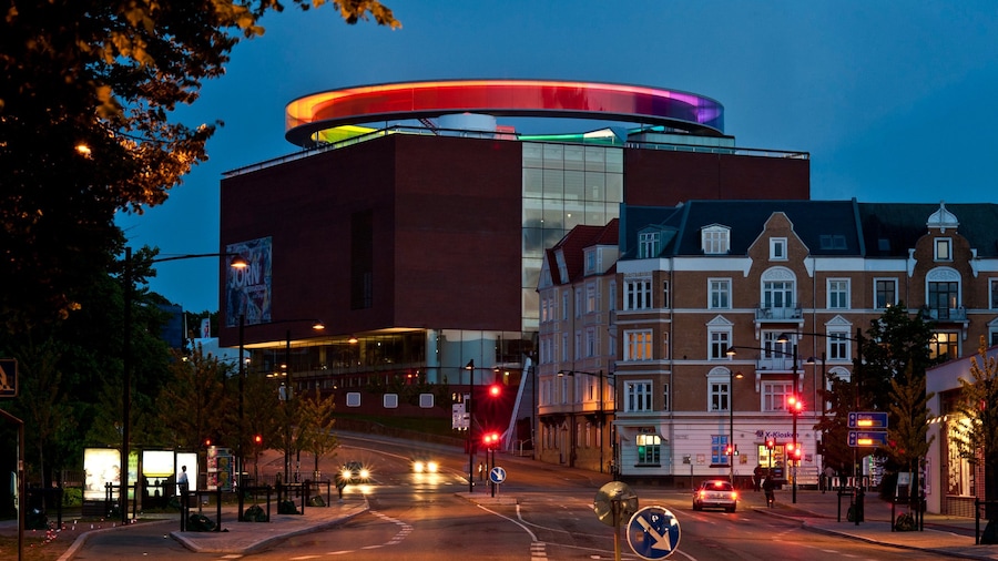 Aarhus which includes night scenes, a city and outdoor art