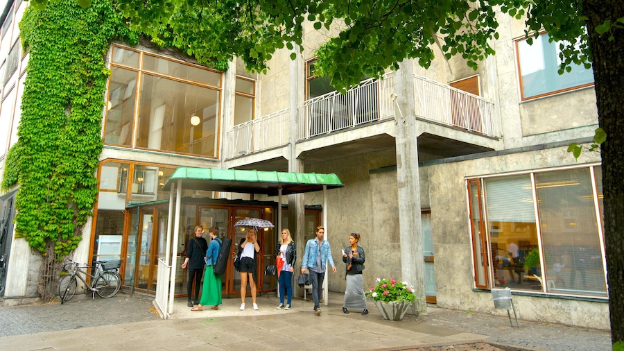 Aarhus City Hall showing an administrative building as well as a small group of people