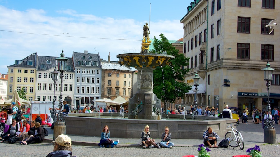 Caritas which includes a square or plaza, a fountain and a city
