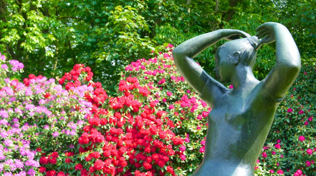 Middelheim Park which includes a statue or sculpture, outdoor art and flowers