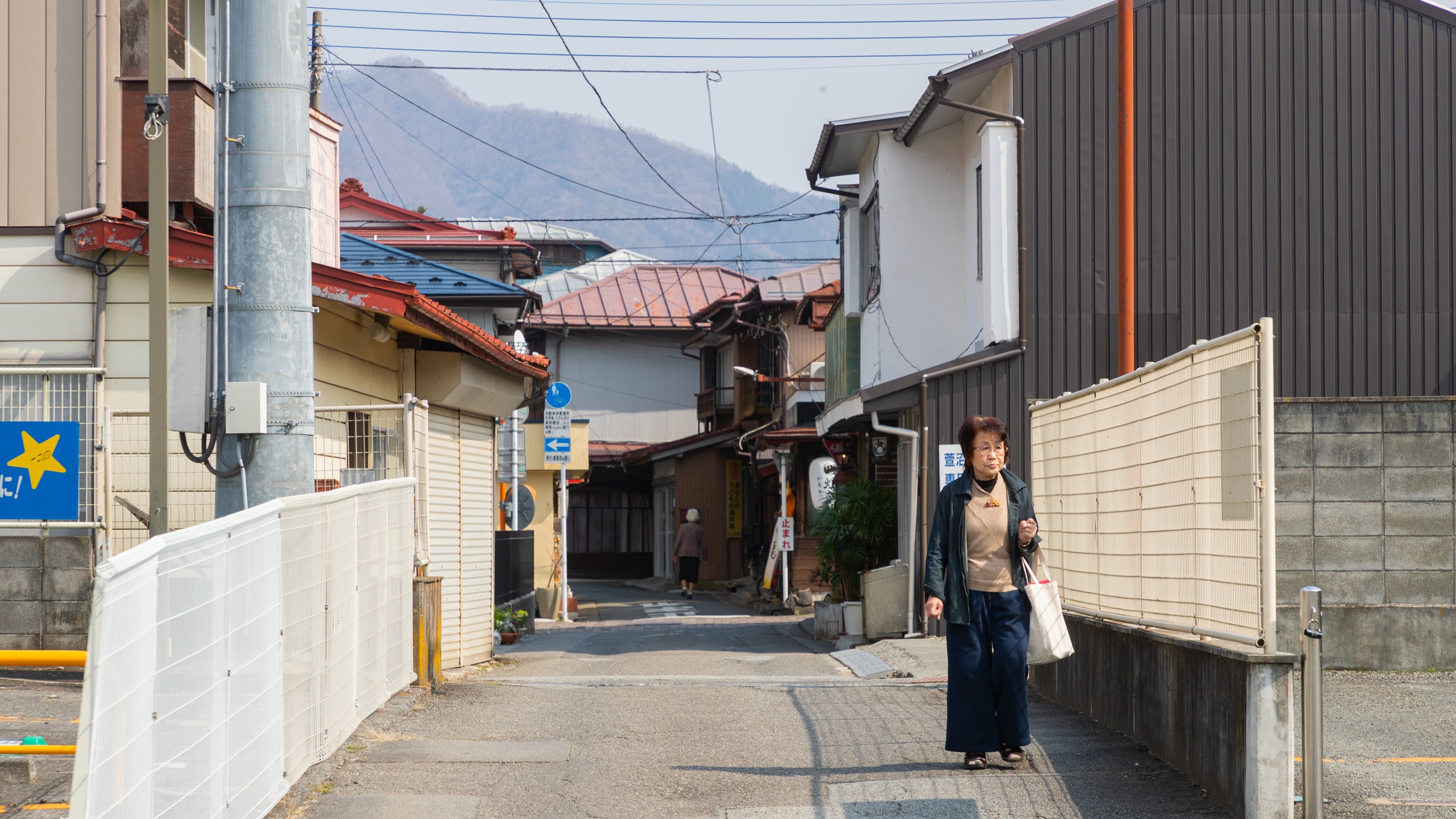 Fujiyoshida showing street scenes as well as an individual femail