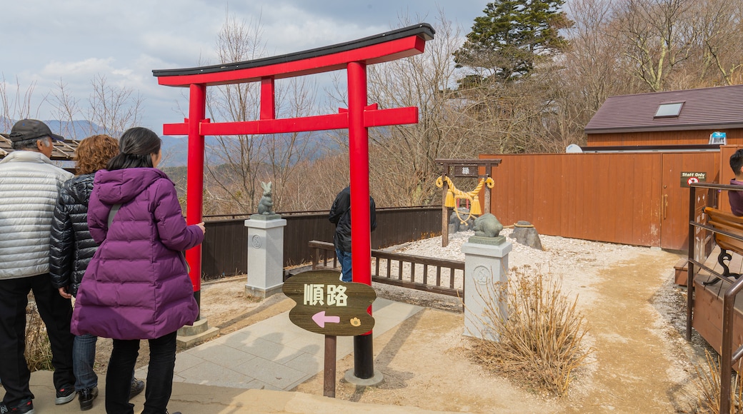 Mt. Kachi Kachi Ropeway featuring heritage elements and a garden as well as a small group of people