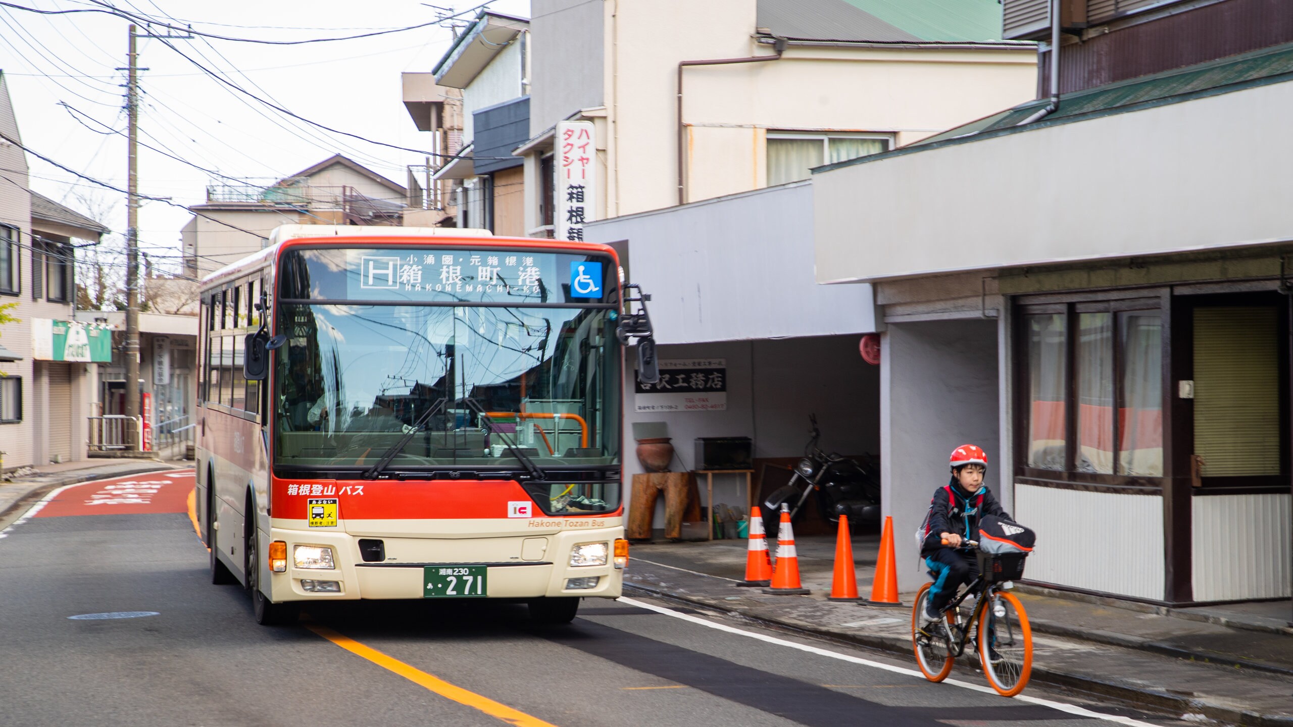 Miyanoshita featuring street scenes and road cycling as well as an individual child