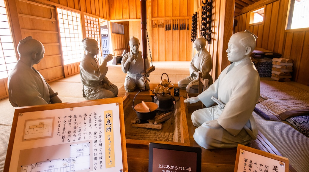 Hakone Checkpoint Museum featuring signage, a statue or sculpture and interior views